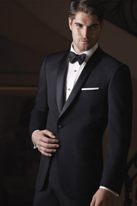 Man in black tuxedo, bow tie.