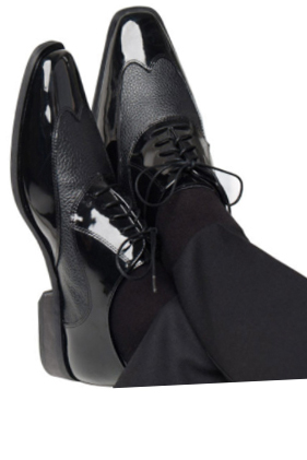 Black leather dress shoes on feet.