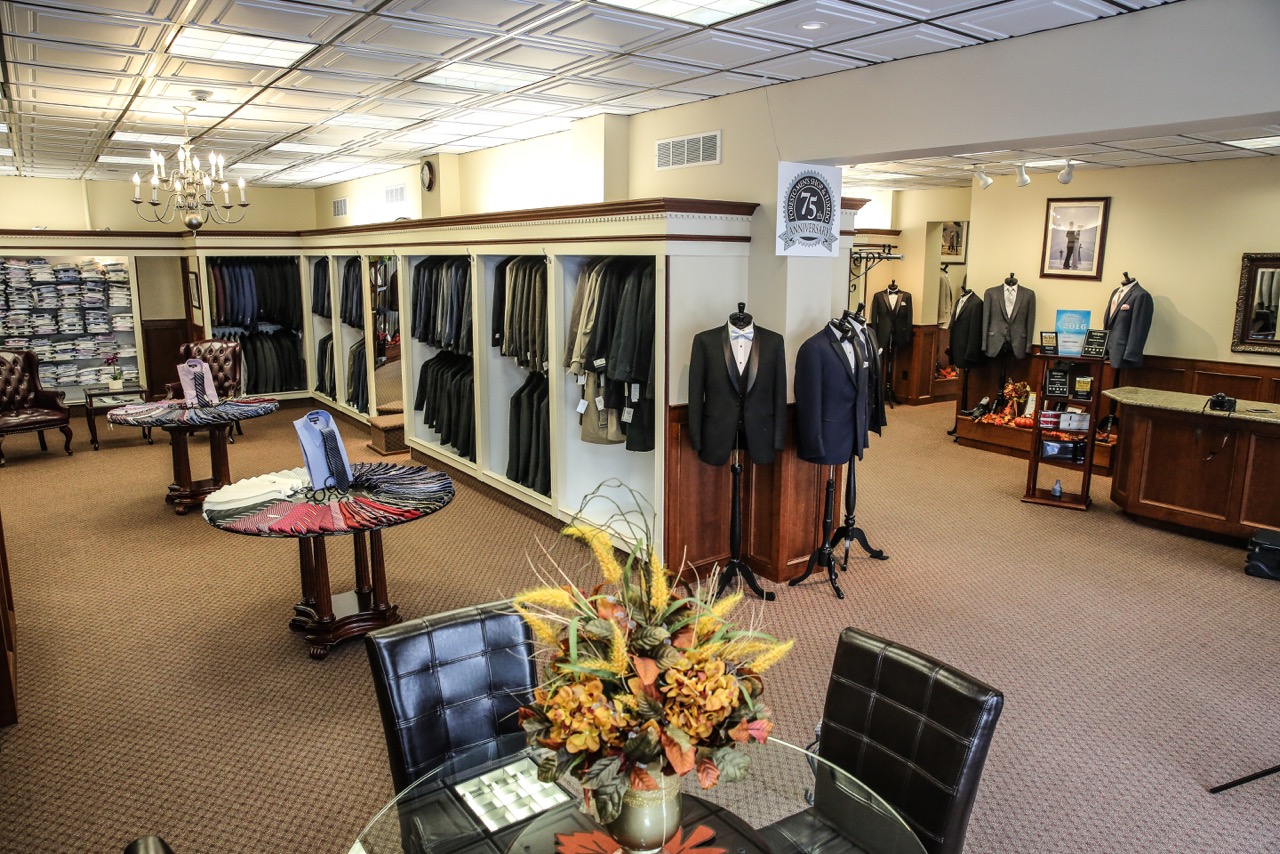 Men's suit shop with many suits.