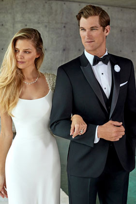 Bride and groom in wedding attire.