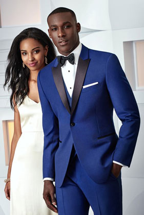 Here's an alt tag for the image: Royal blue tuxedo, black lapel, wedding attire.