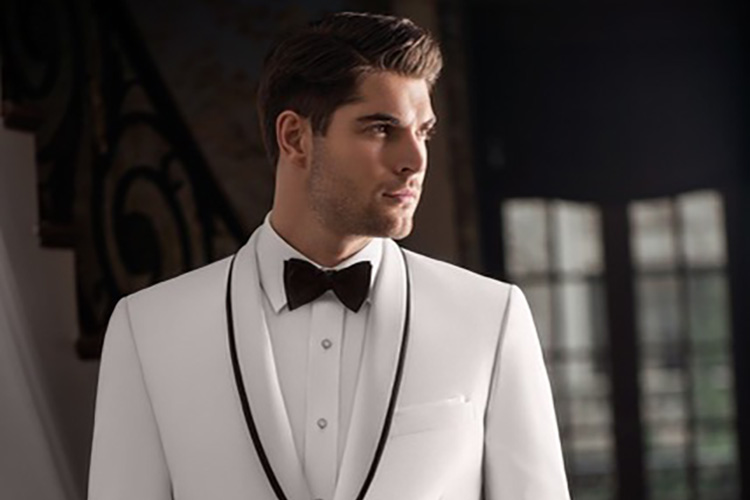 Man in white tuxedo, black bow tie.