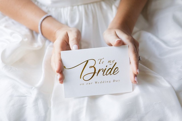 Bride holding wedding day message.