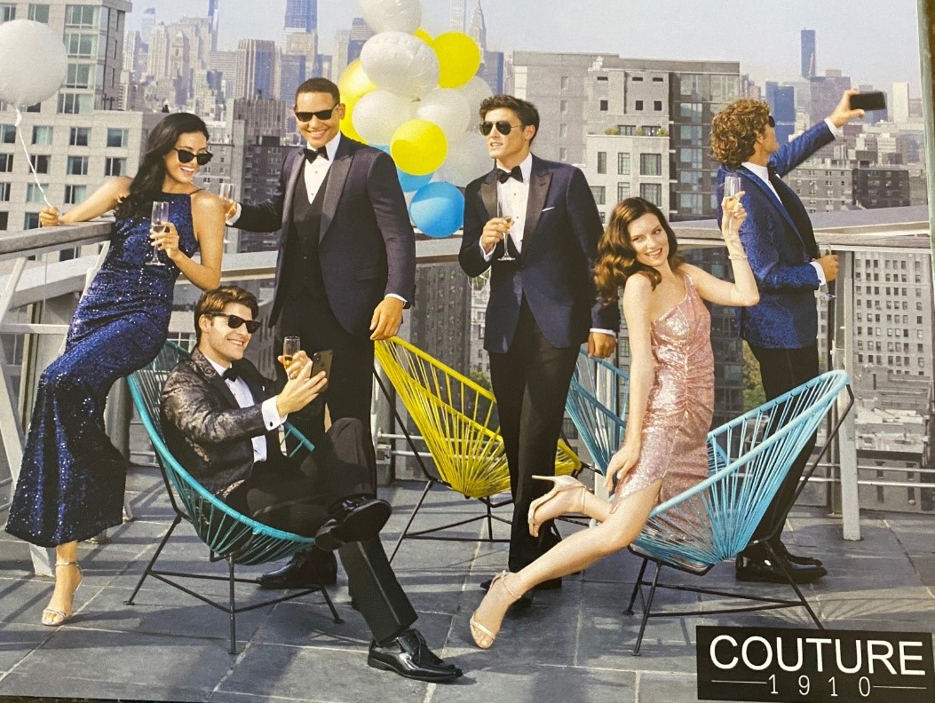 Friends celebrating in stylish attire.