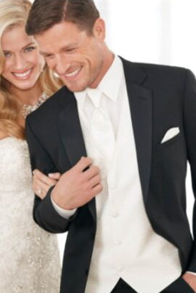 Groom in tuxedo with his bride.