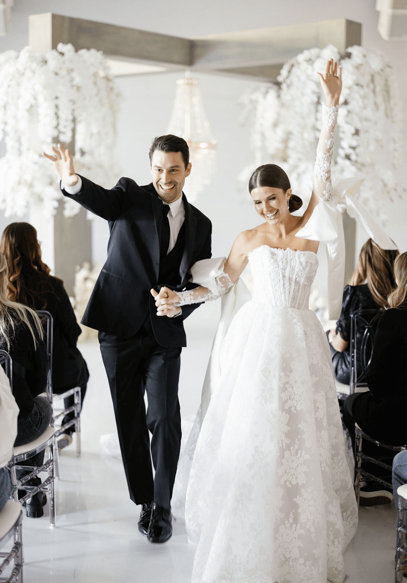 Happy newlyweds exiting wedding ceremony.